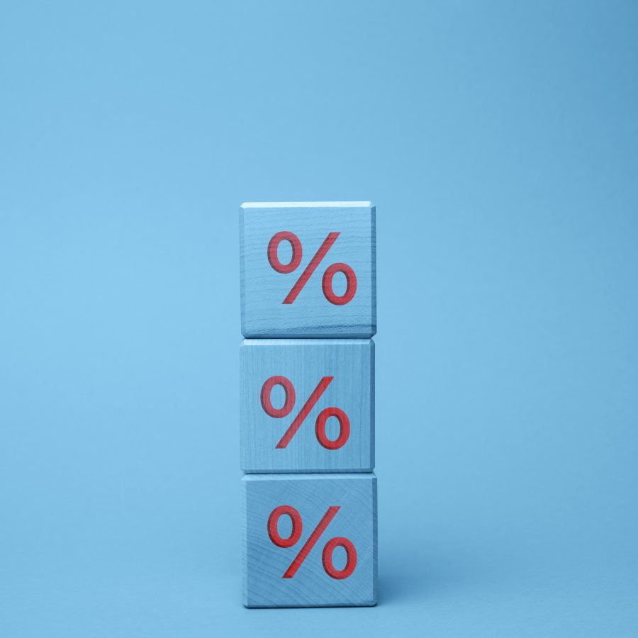 wooden blocks with percent on a blue background the concept of
