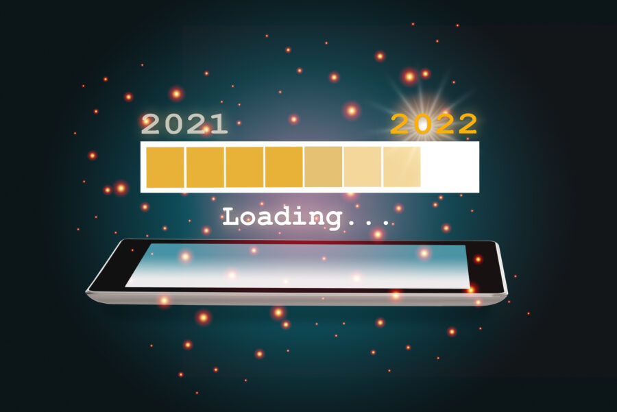 year 2021 loading to new year 2022 on smartphone on abstract background